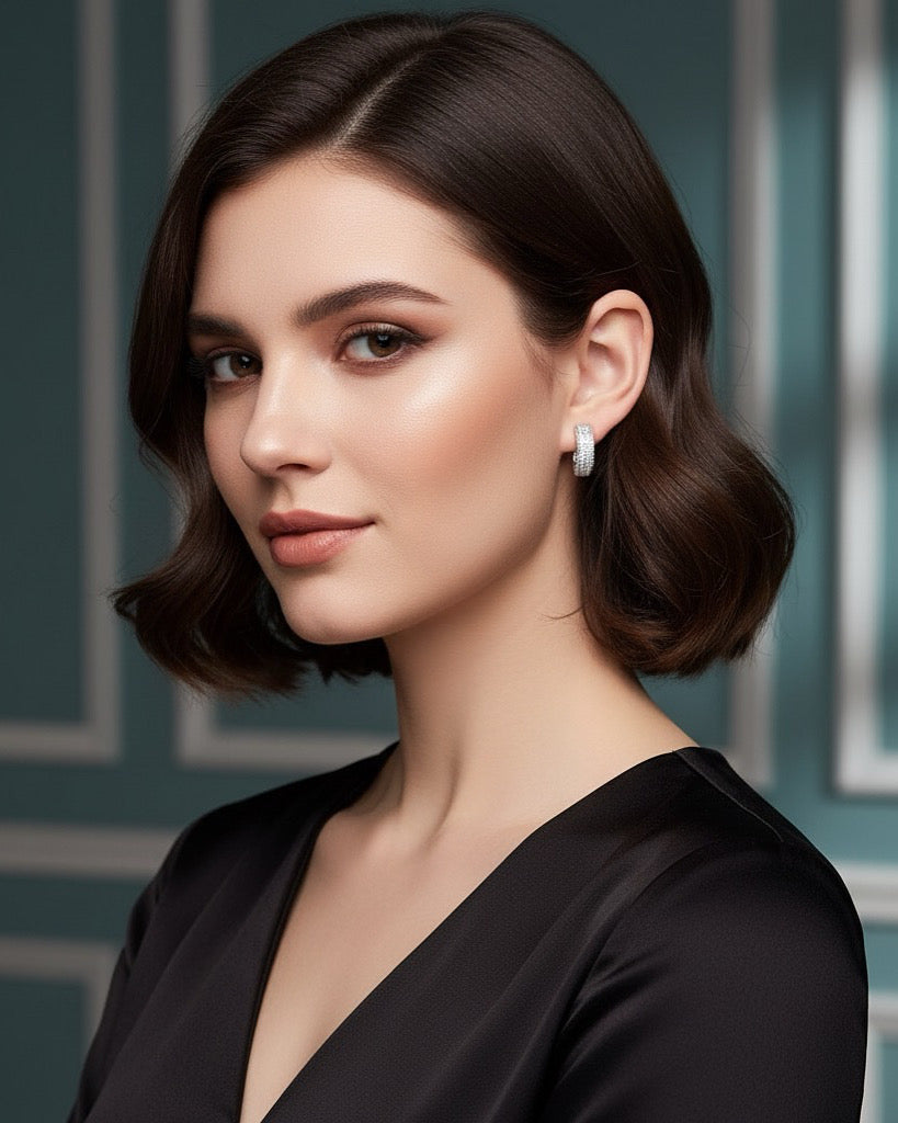 Round Silver Moissanite Studs.
Crafted in genuine 925 Sterling Silver and adorned with brilliant Moissanite stones, they promise an unforgettable touch of glamour.